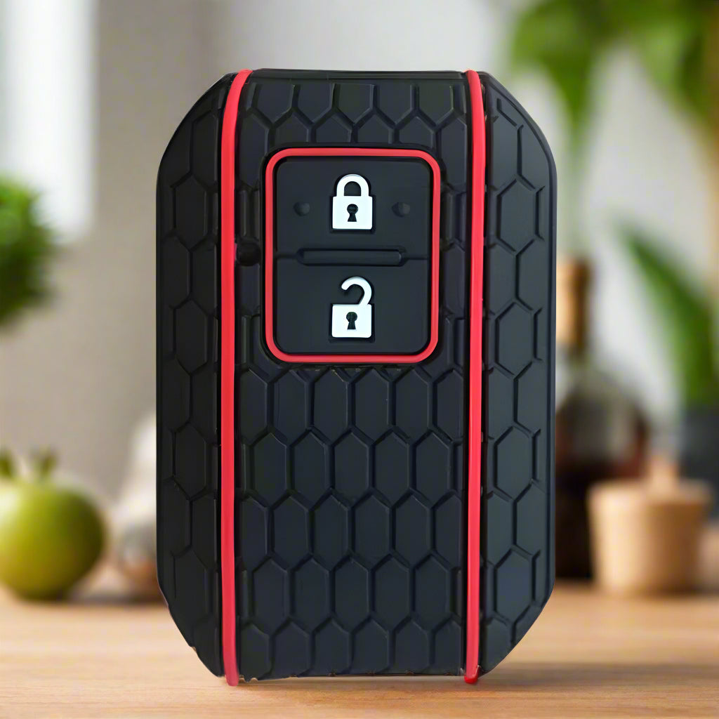 Fekete színű, 2 gombos Suzuki kulcs szilikon tok piros mintával.