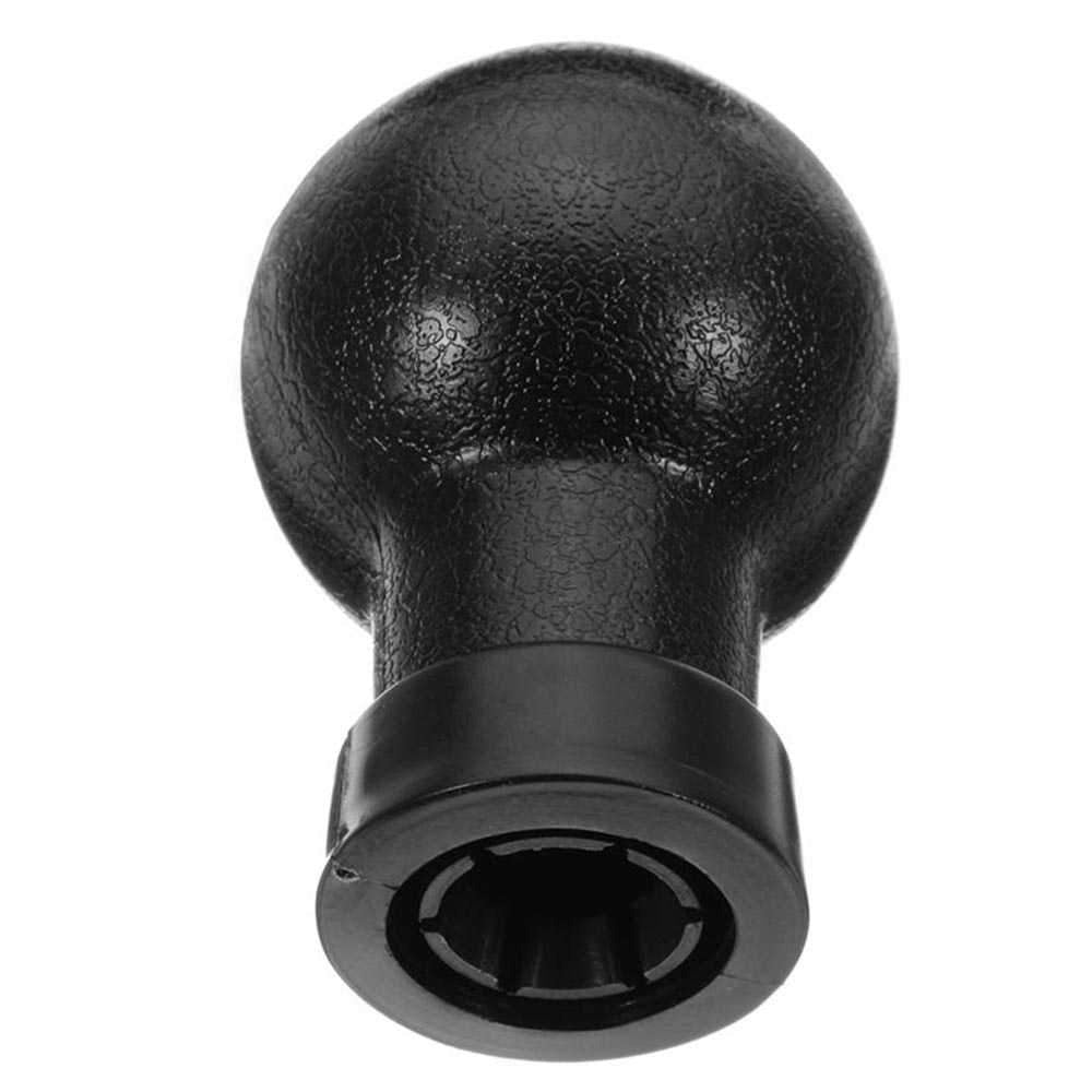 Fekete színű, 5 sebességes Fiat váltógomb.