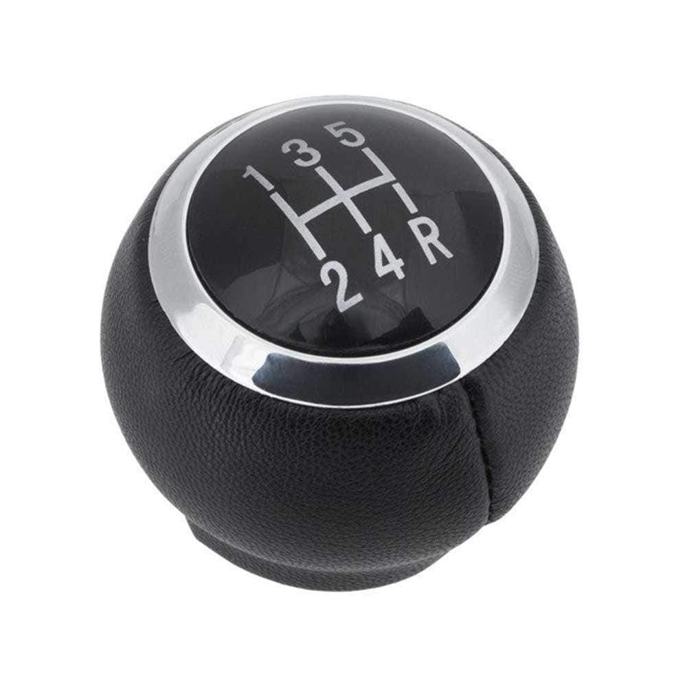 Fekete színű, bőrözött 5 sebességes Toyota váltógomb. Fekete színű számlappal, króm számlapkerettel.