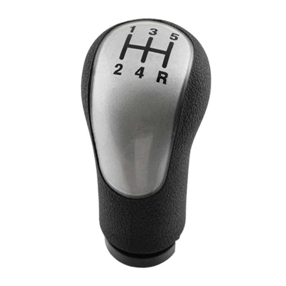 Fekete színű, 5 sebességes Ford váltógomb. Ezüst színű üveg számlappal.