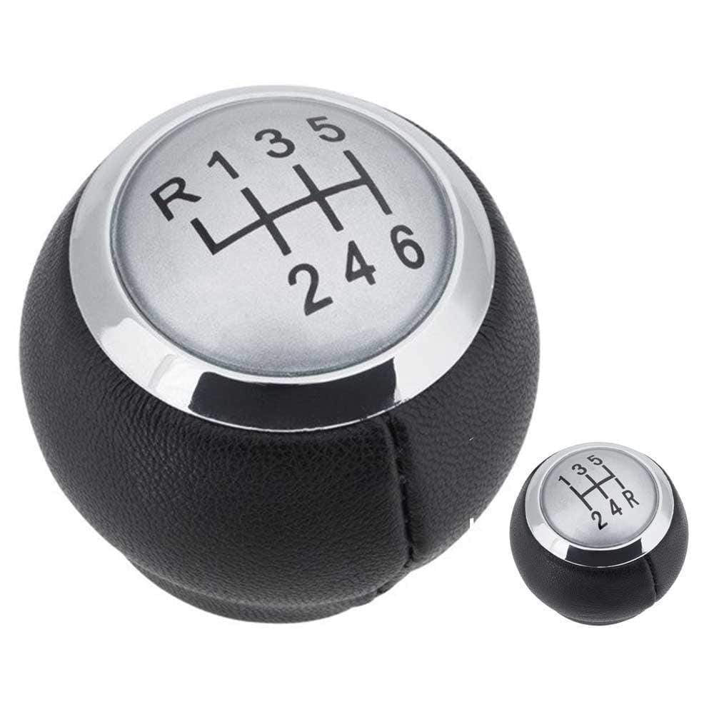 Fekete színű, bőrözött 5 és 6 sebességes Toyota váltógomb. Ezüst színű számlappal, króm számlapkerettel.