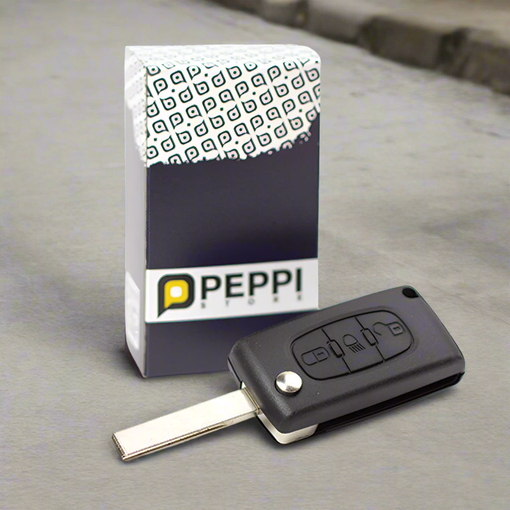 Fekete színű, 3 gombos Citroen kulcs, bicskakulcs mintás díszdobozzal.