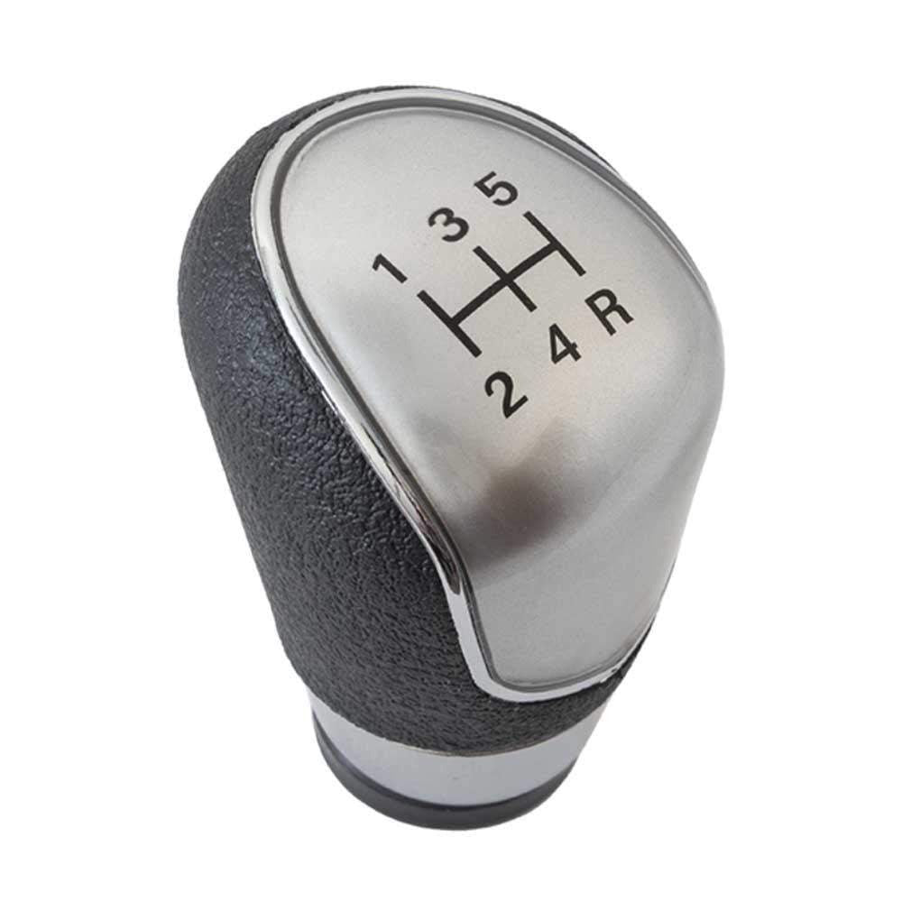 Fekete színű, 5 sebességes Ford váltógomb. Ezüst számlappal, króm számlapkerettel.