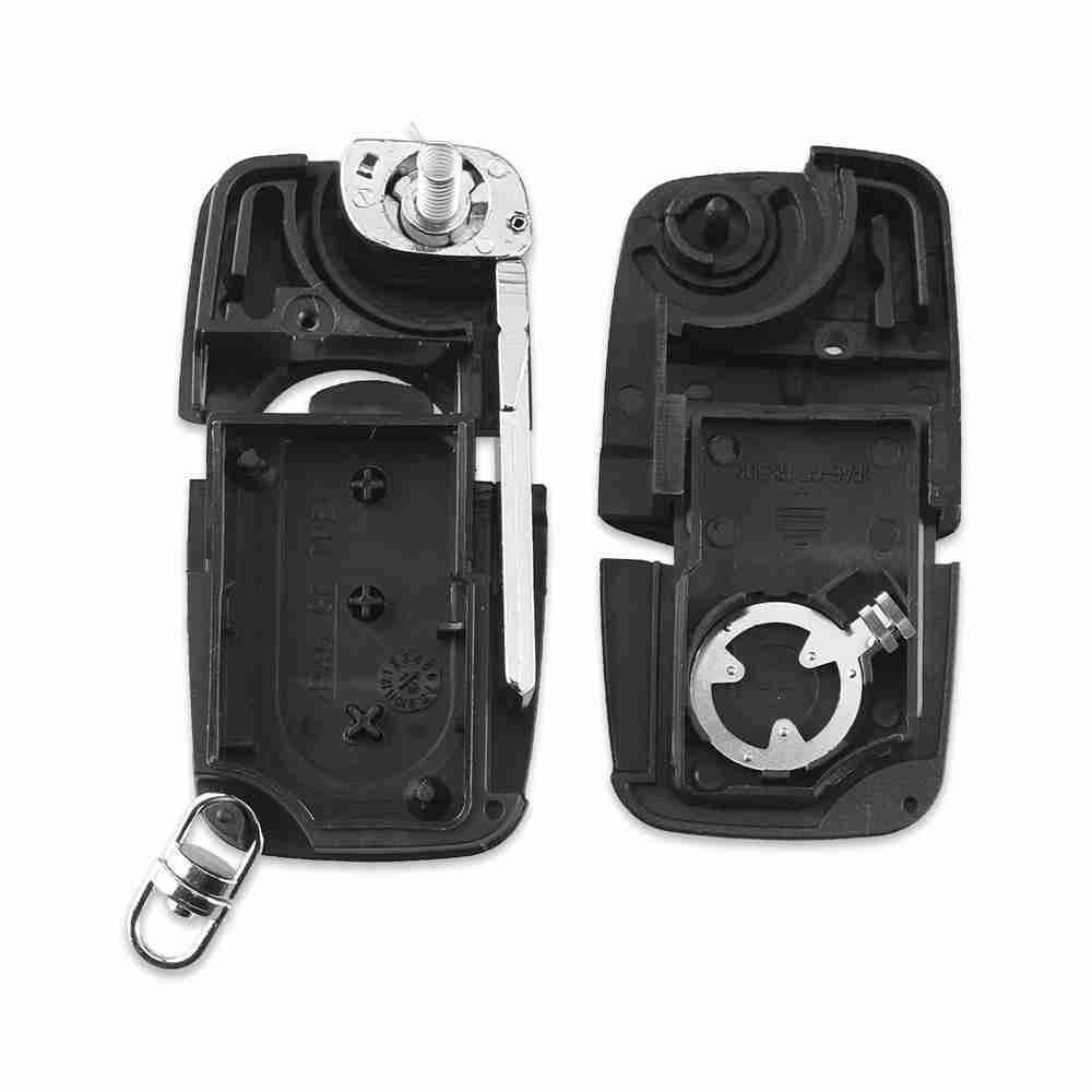 Fekete színű, 3 gombos Audi bicskakulcs, kulcsház belseje.