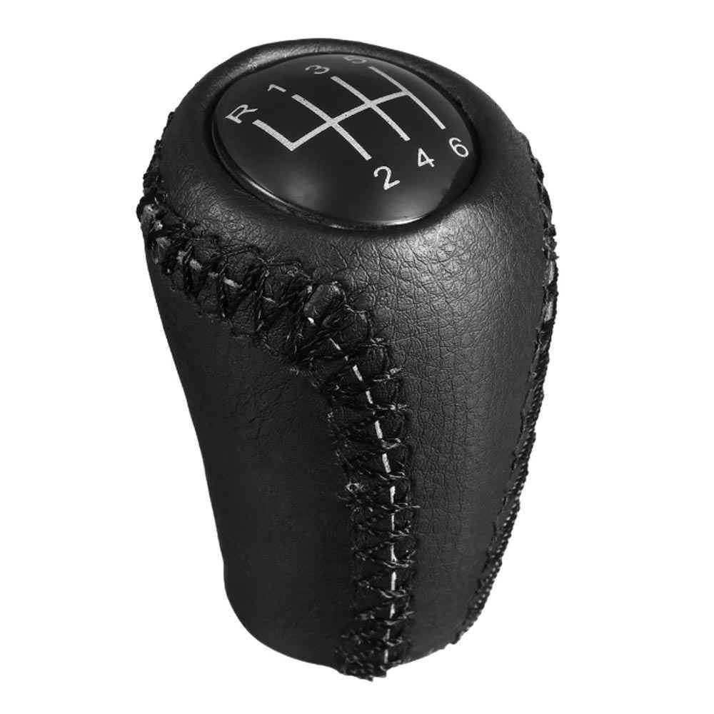 Fekete színű, 6 sebességes bőr Mazda váltógomb. 6 fokozatos üveg számlappal