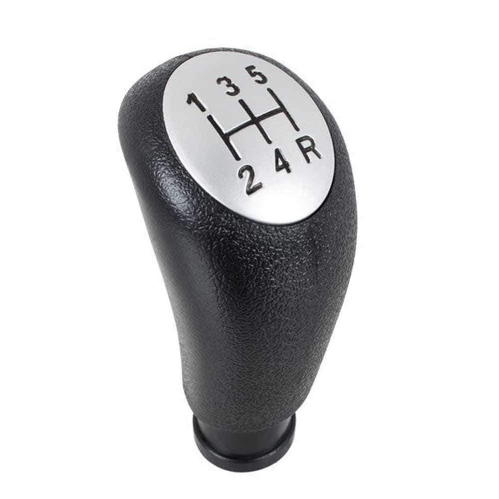 Fekete színű, 5 sebességes Alfa Romeo váltógomb. Ezüst színű számlappal.