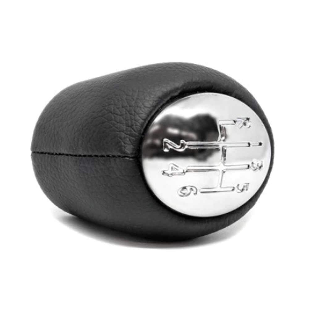 Fekete, bőrözött 6 sebességes Renault váltógomb. Krómozott számlappal.