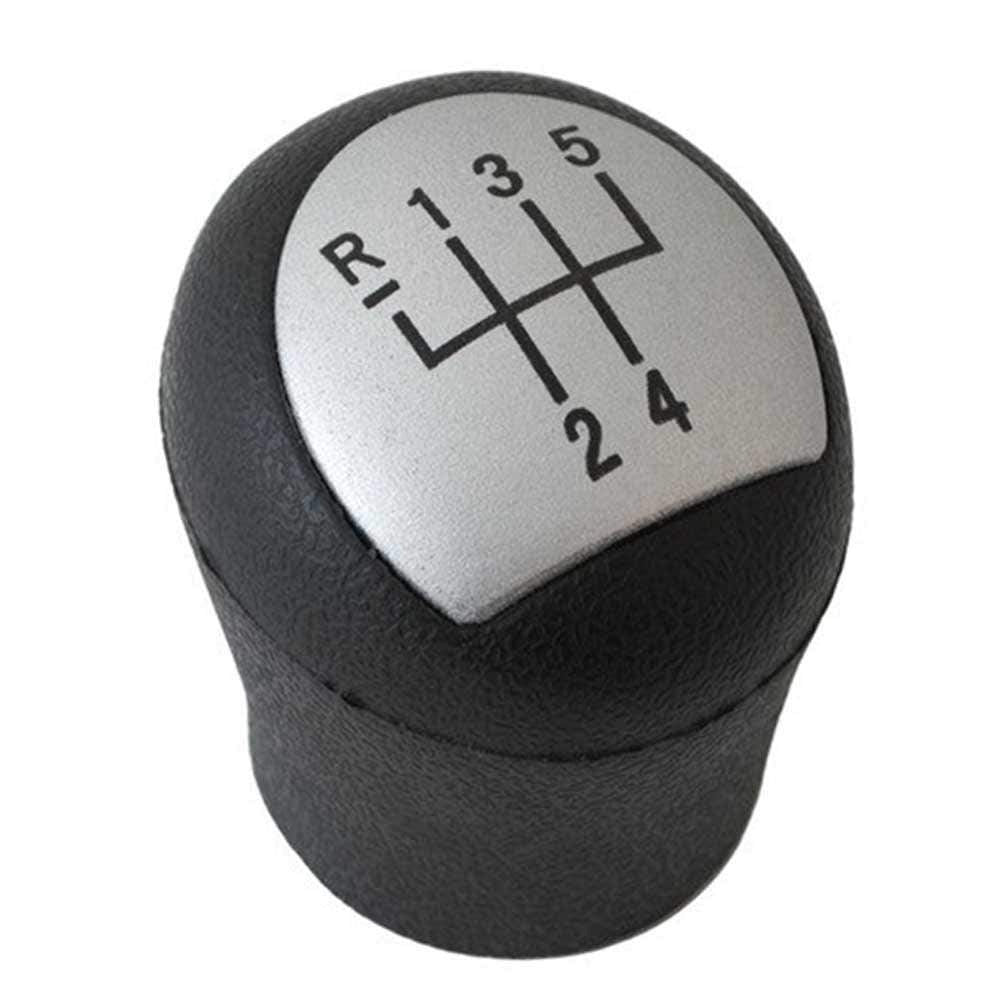 Fekete színű, 5 sebességes Renault váltógomb. Szürke, 5 fokozatos számlappal.